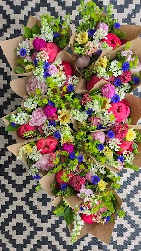 Colorful seasonal subscription bouquets arranged together